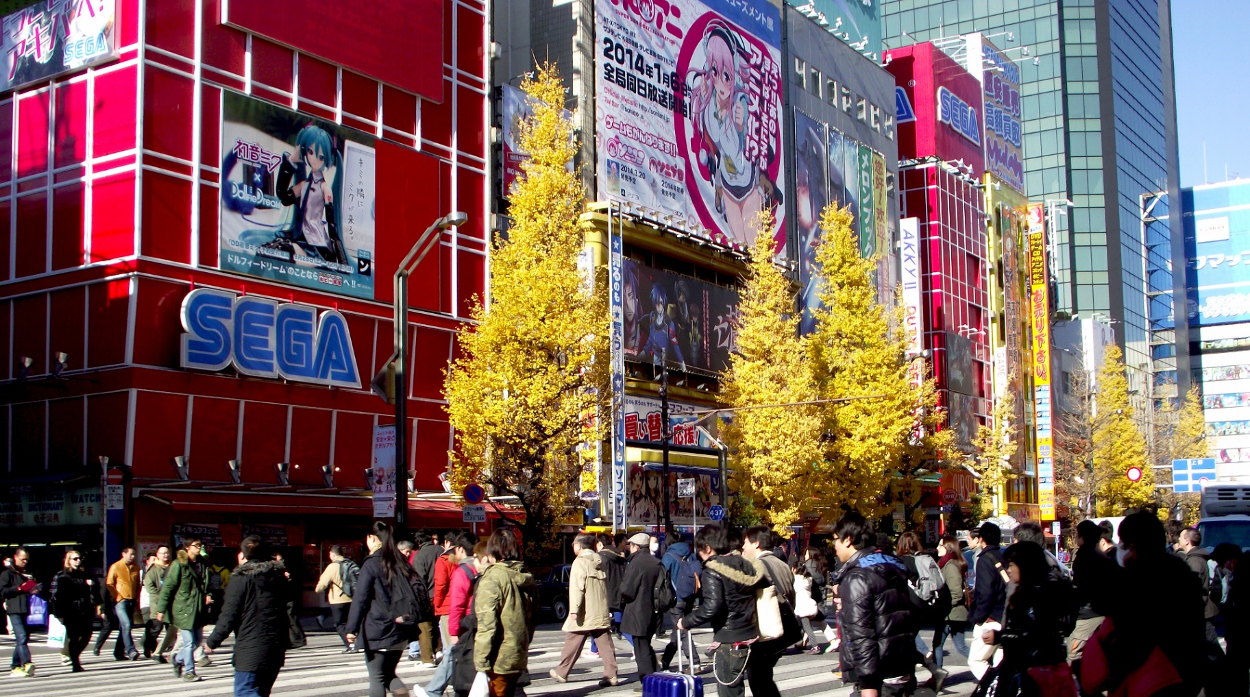 Pedestrians and anime billboards in Akihabara