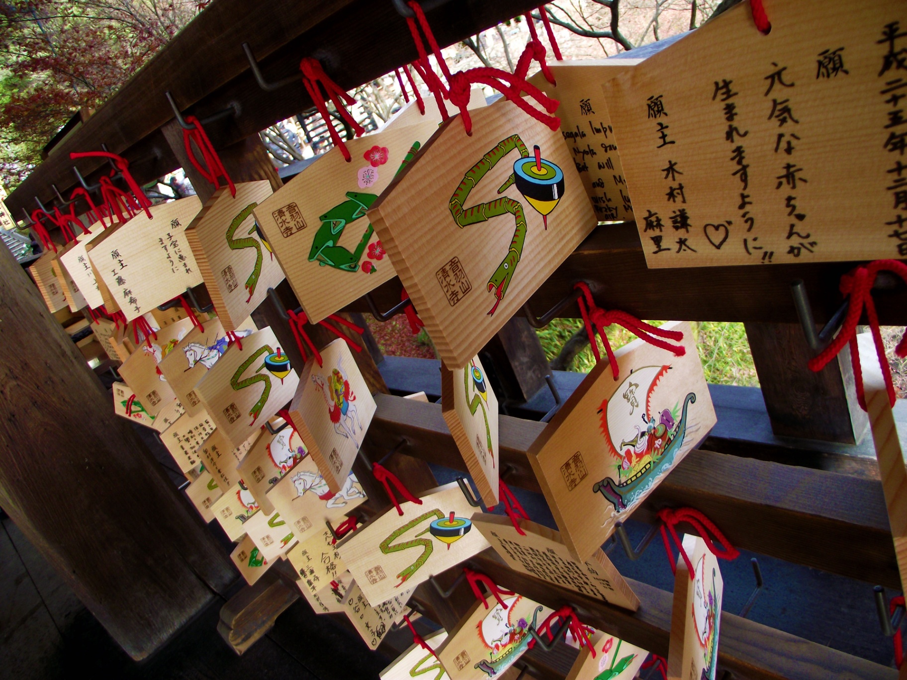 Wooden ema plaques with handwritten wishes